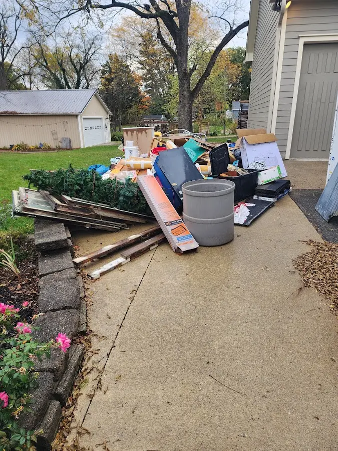 Dumpster being loaded with debris for Estate Cleanout Dumpster Rental in Murrysville